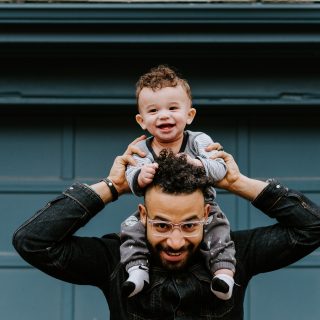 Dad with son on his shoulders