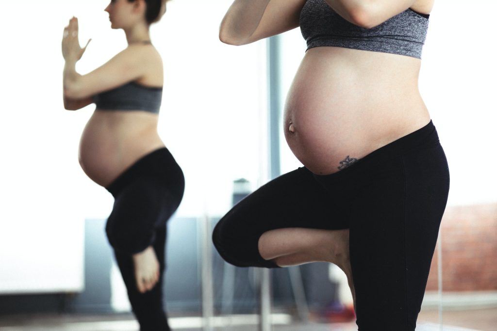 Pregnant women practising yoga