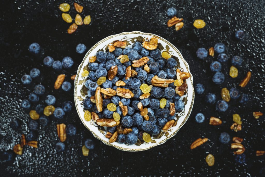 Healthy bowl of walnuts an blueberries